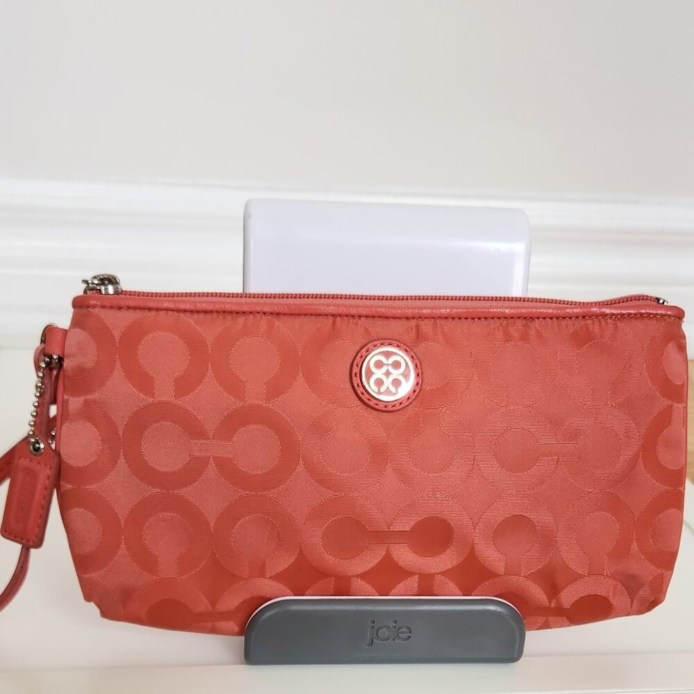 COACH SIGNATURE CORAL PINK NYLON WRISTLET PURSE.